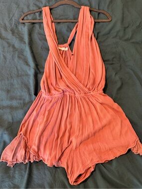 Coral, low plunge front, backless, ruffled Indian romper